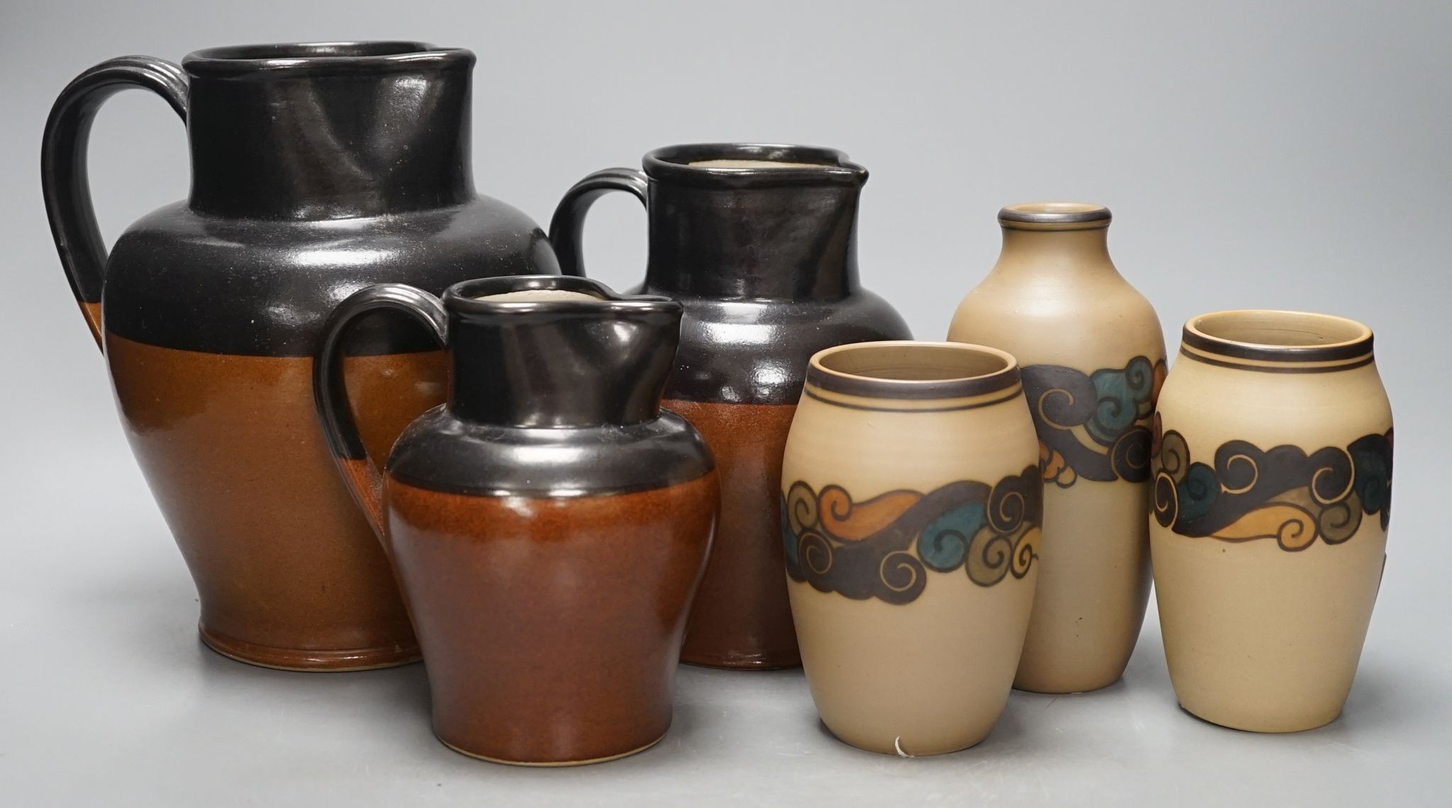 A graduated set of three Bourne Denby stoneware jugs and three 1930's stoneware vases, by Bornholm, Denmark (6)